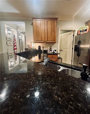Premium granite countertops provide ample prep space in this well-appointed kitchen.