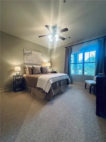 A well-lit bedroom provides ample relaxation and comfort.