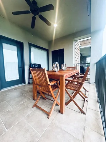 Enjoy outdoor relaxation on this tiled balcony, perfect for al fresco dining.