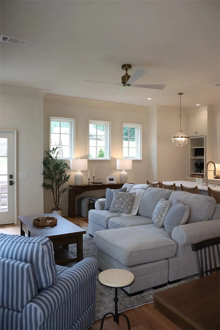An open floor plan connects the inviting living space with the adjacent kitchen.