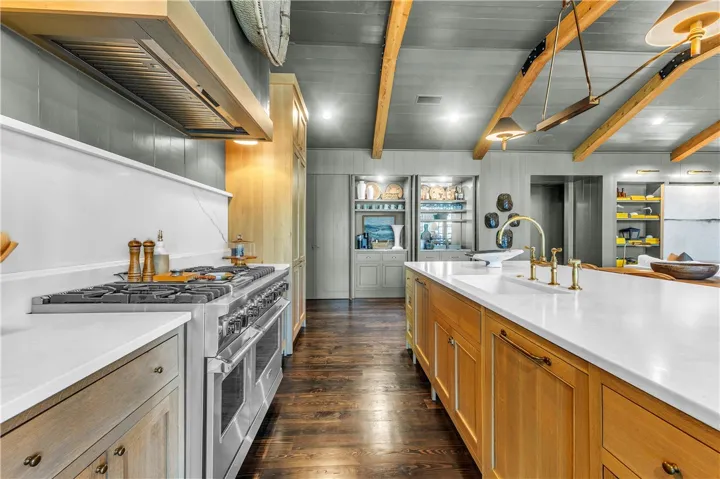 Gourmet kitchen with sleek appliances and ample counter space, perfect for culinary endeavors.