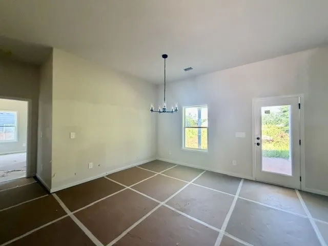 A well-lit, open interior space awaits your personal touch.