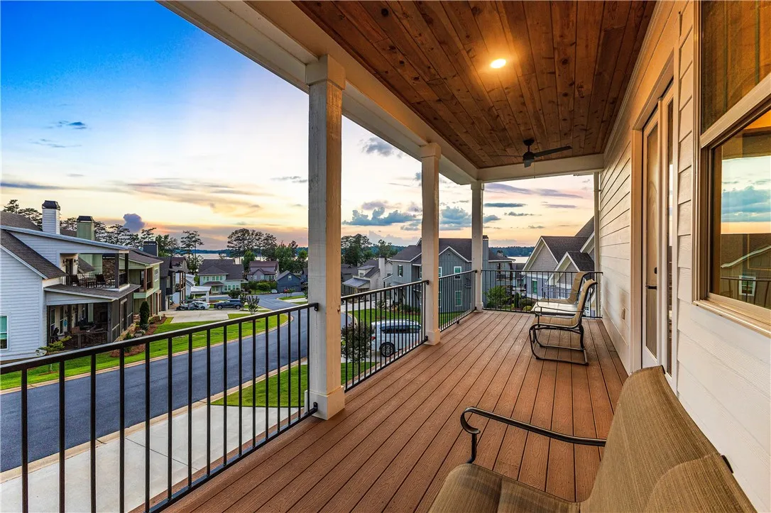 Unwind on this spacious balcony overlooking a serene lake and vibrant neighborhood.
