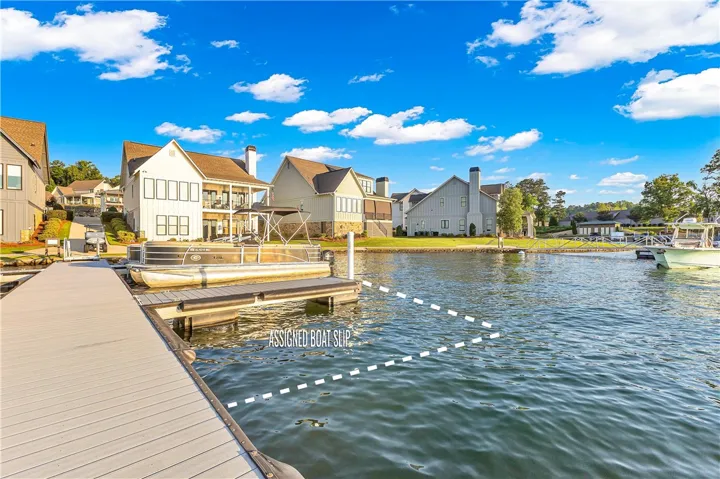 A private boat slip awaits at this charming lakeside property, perfect for waterfront living.