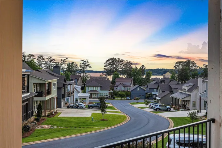 Overlooking a tranquil lake, this residential community offers a harmonious blend of nature and modern living.