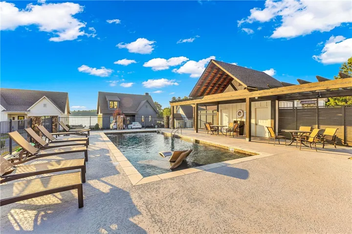 An inviting pool area offers a refreshing oasis with ample space for lounging and entertaining.
