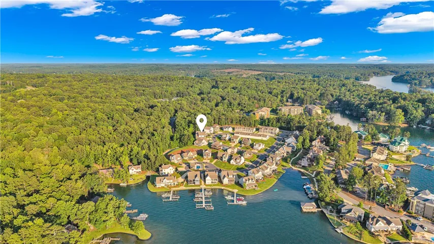 Discover a vibrant lakeside community nestled amongst lush forests, complete with private docks and inviting homes.