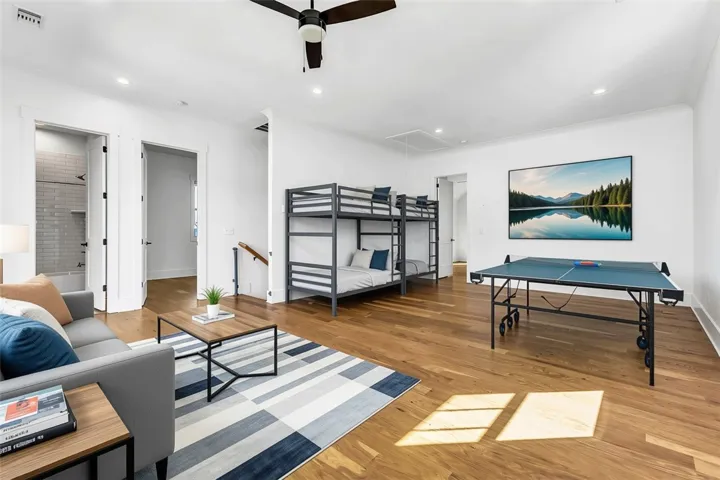 An inviting family room offers abundant space for leisure, games, and extra sleeping arrangements.