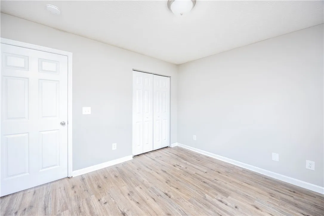 LVP flooring graces this versatile room, offering clean lines and modern appeal.