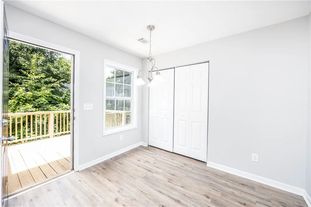 Natural light fills this room with its access to the outdoors and durable LVP flooring.