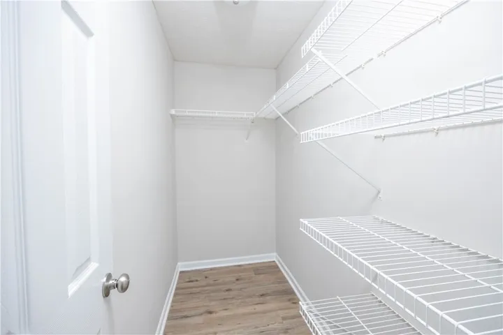 One of two closets in the primary bedroom.