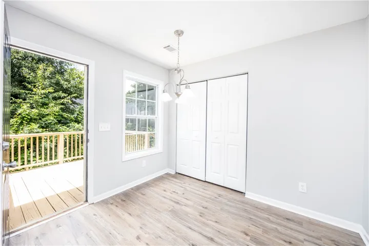 Natural light fills this room with its access to the outdoors and durable LVP flooring.