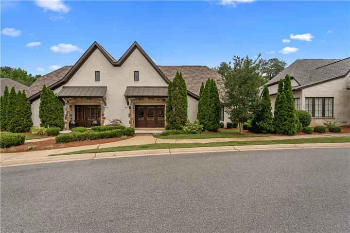 Elegant brick and stone facade welcomes you to this meticulously landscaped residential property.