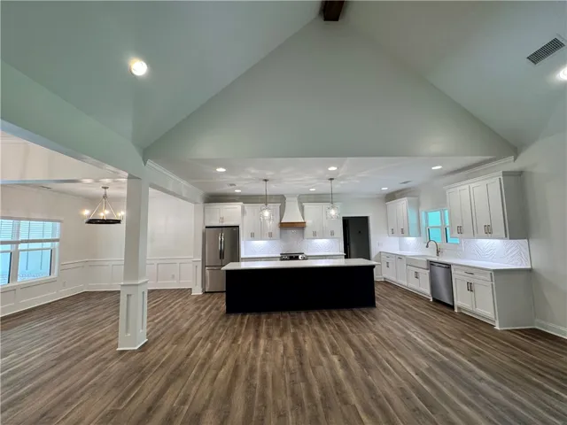 An airy, open-concept kitchen and dining area provides a seamless flow for daily living.