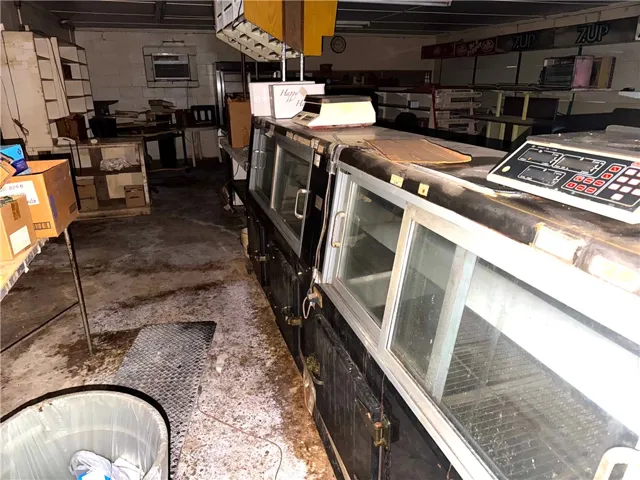 A commercial space with multiple display refrigerators awaits its next chapter.