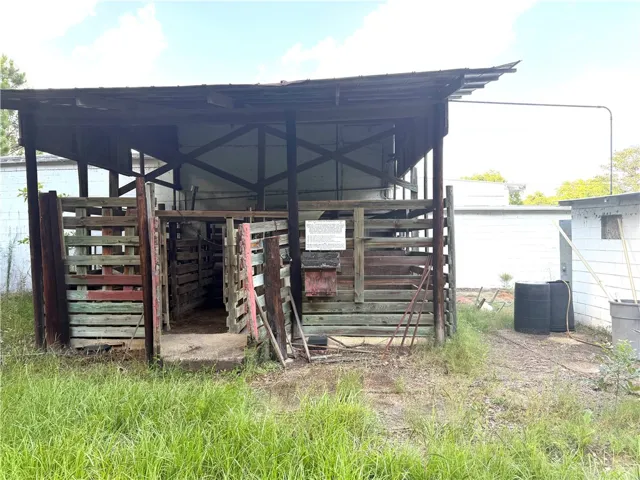 A well-worn wooden barn stands ready for various agricultural pursuits.