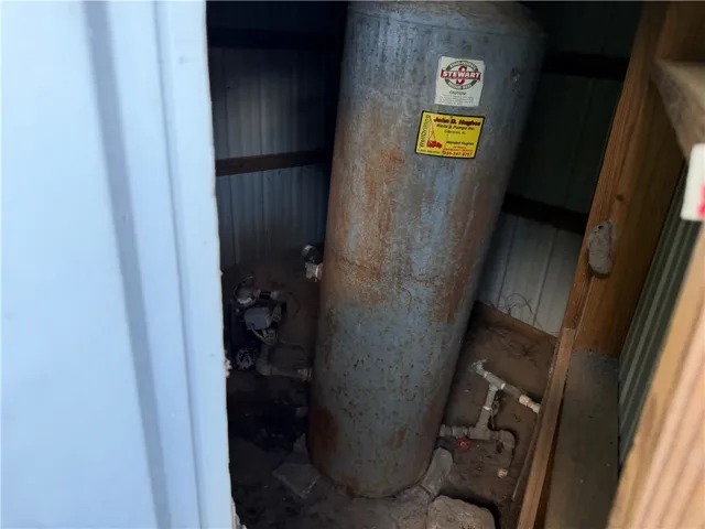 Essential well equipment and a large pressure tank for reliable water service.