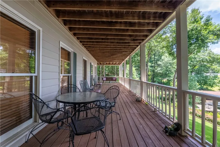 Relax on this inviting covered porch with ample space for outdoor living.