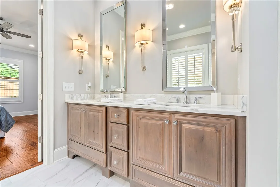 Stunning! The elegant primary bath showcases refined finishes and timeless design.