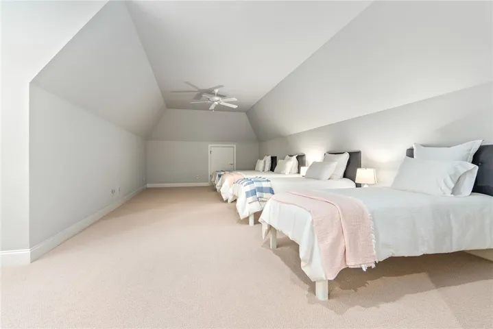 Exceptionally spacious, the upstairs bedroom is currently arranged to host the grandchildren with room to spare.