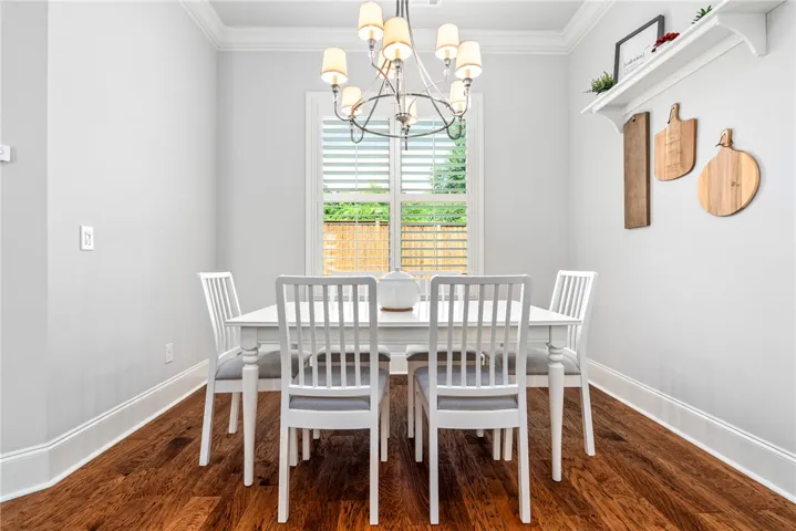 The sunny breakfast room is perfectly suited for casual meals and morning coffee.