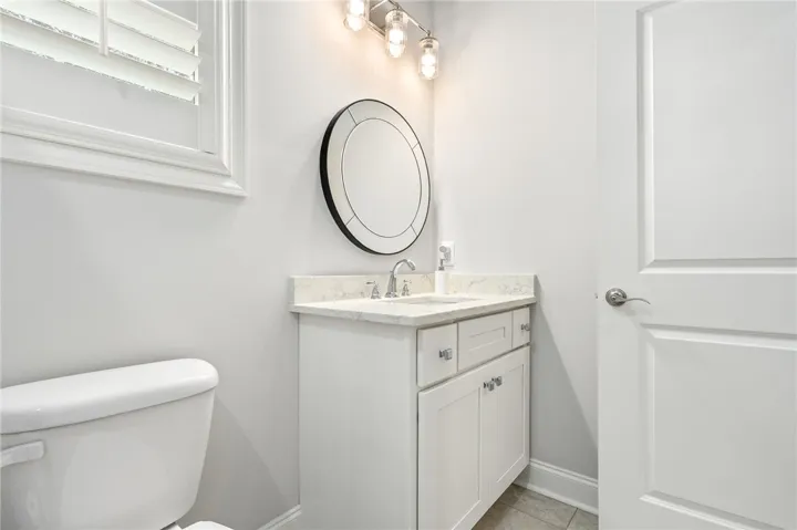 The tasteful second-floor bath serves the bedroom and bonus room.