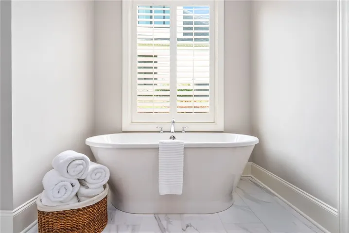 Soak the day away in the free-standing tub tucked under a window.