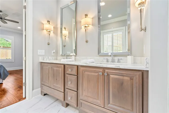 Stunning! The elegant primary bath showcases refined finishes and timeless design.