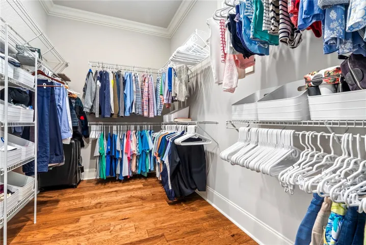 The oversized walk-in closet offers exceptional storage and organization.