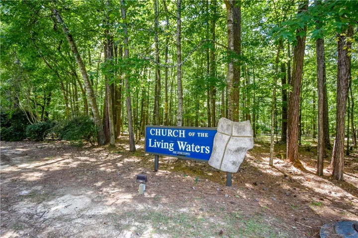 A tranquil wooded lot offers serene natural surroundings.