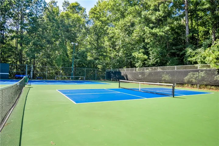Sporting amenities include a tennis court, offering residents an active outdoor lifestyle.
