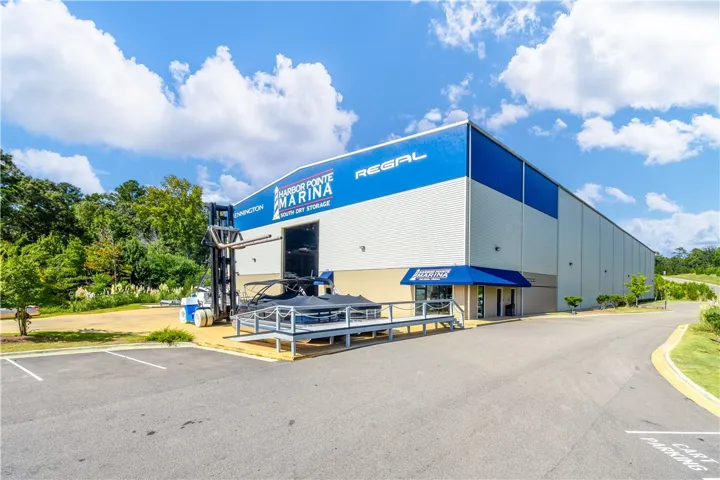 Secure boat storage facility with a dedicated parking lot and convenient access.