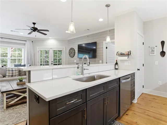 An open concept design seamlessly connects the gourmet kitchen to the sun-drenched living space.