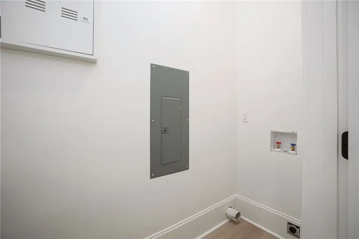 Ready for your washer and dryer, this dedicated laundry space offers convenience.