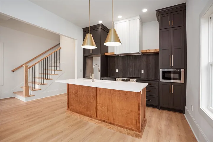 A spacious, open-concept kitchen with sleek, modern appliances and a welcoming island.