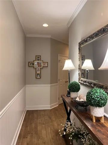 Clean lines and wood-look flooring create a welcoming entry.
