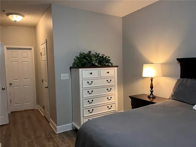 Well-lit and tranquil, this sleeping area features durable wood flooring.