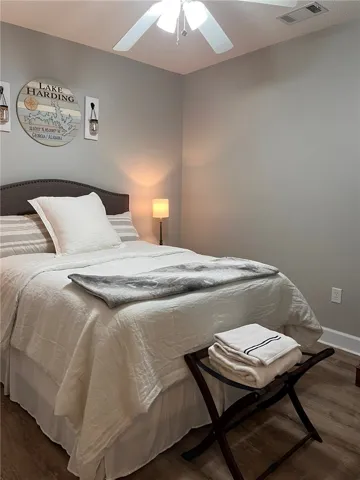 Relax in this well-appointed room featuring practical flooring and overhead lighting.