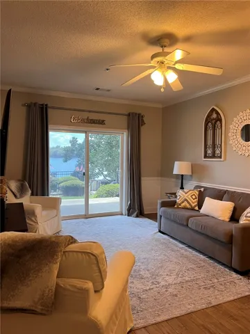 A comfortable living space offers seamless access to outdoor serenity through sliding glass doors.