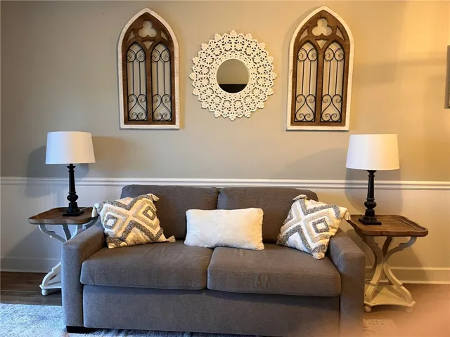 A welcoming living area provides a comfortable retreat for relaxation and quiet contemplation.