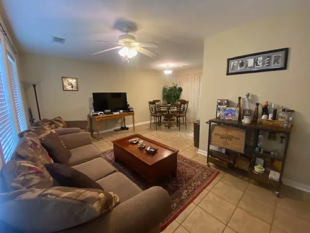 An inviting open-concept layout connects the living area with a bright dining space.