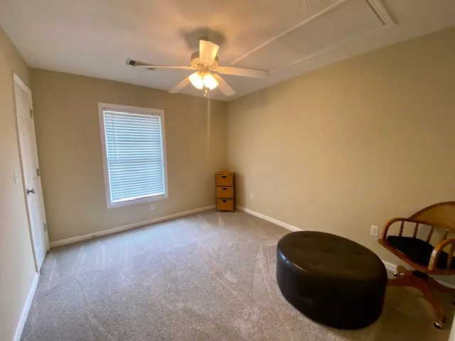 Well-lit room provides a neutral canvas, adaptable for various living needs.