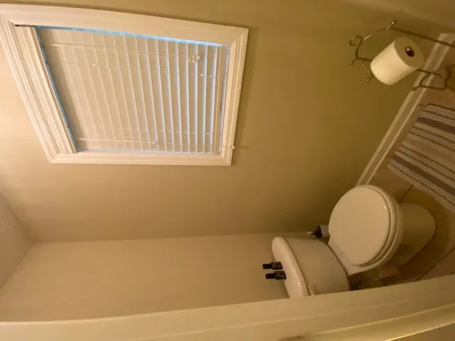 A well-lit water closet provides essential privacy and convenience.
