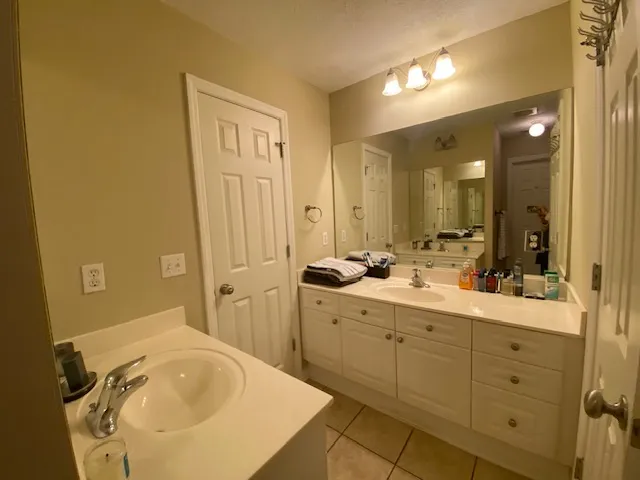 Ample counter space and dual sinks create a practical and comfortable environment.