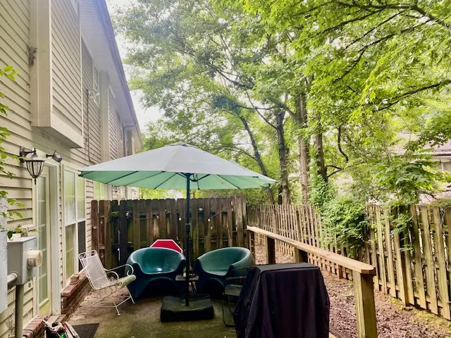 A private patio, perfect for intimate outdoor dining, offers a tranquil escape surrounded by nature.