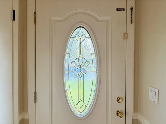 Interior view of the entry way door with glass detail.