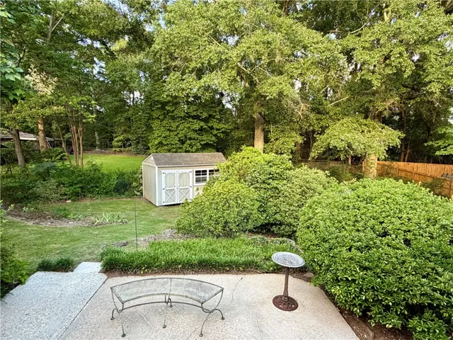 An inviting backyard patio offers a perfect place to gather.