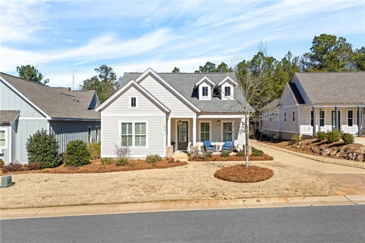 A charming single-family residence with dormer windows and a welcoming front porch awaits.