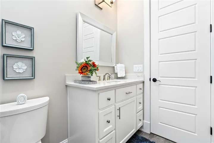 A pristine bathroom vanity, complete with a gleaming sink and elegant countertop, awaits for daily rejuvenation.