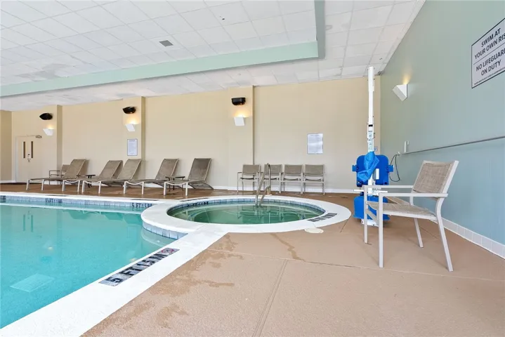 An inviting indoor pool and spa provide a serene aquatic escape for year-round enjoyment.